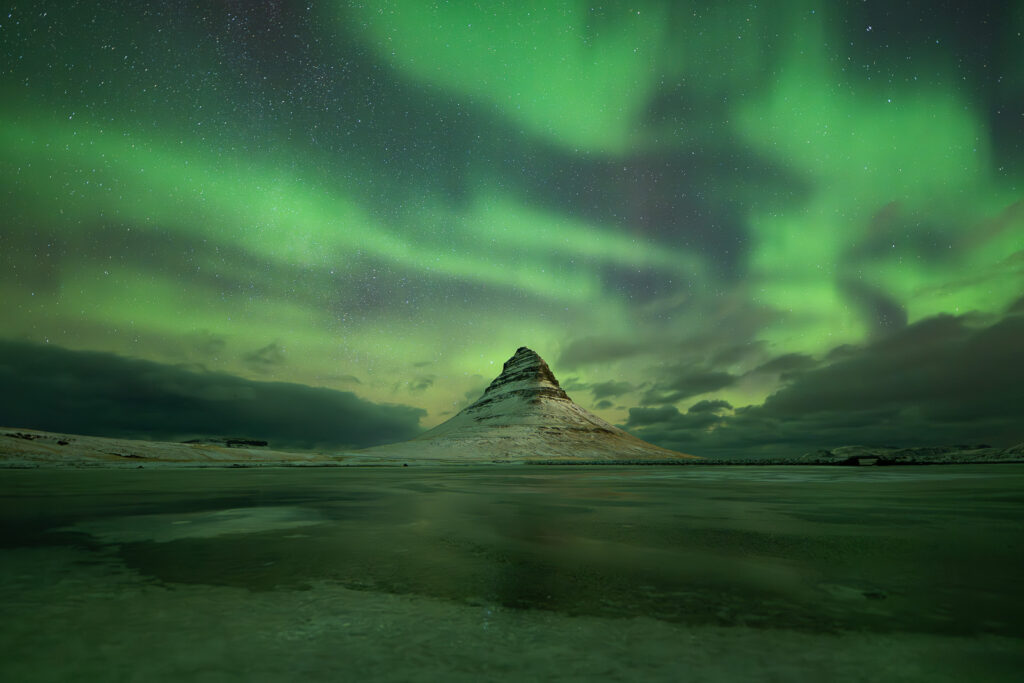 Auroras above Kirkjufell in Iceland