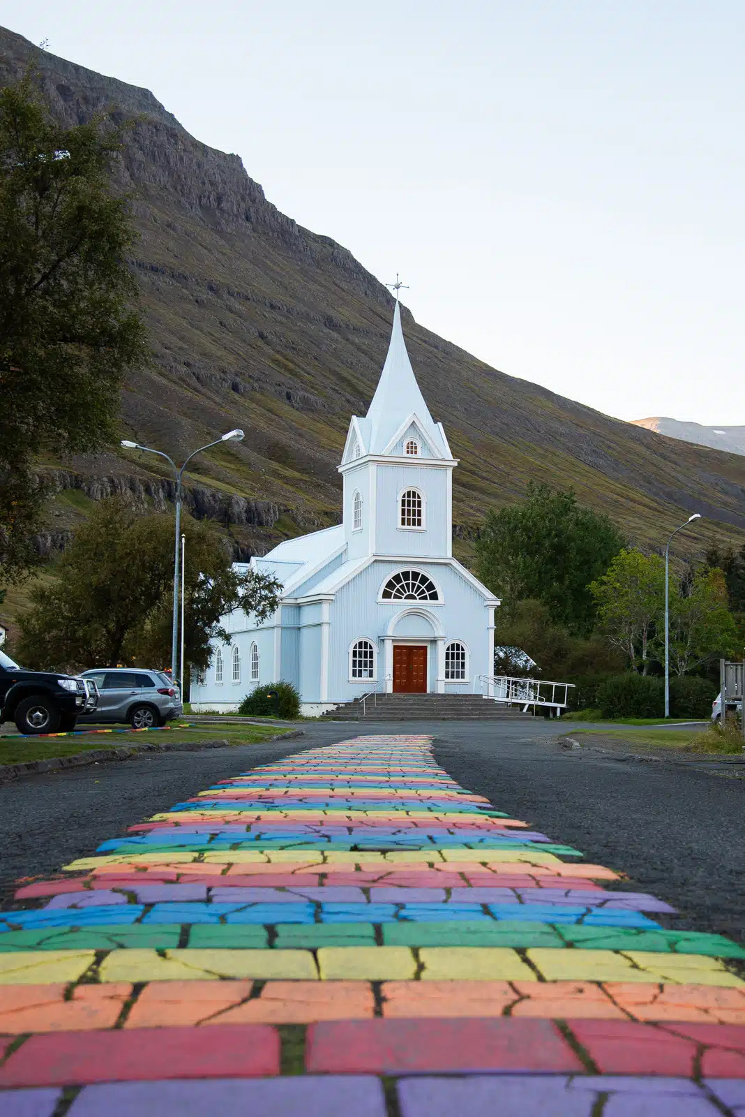 Seyðisfjörður church in the east Fjords, with its typical rainbow walk on the foreground